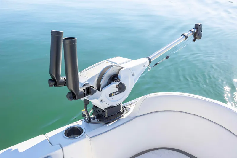 Slide: The Image of 2024 Sea Hunt Ultra 239 SE fishing rod holder on calm water. - 23