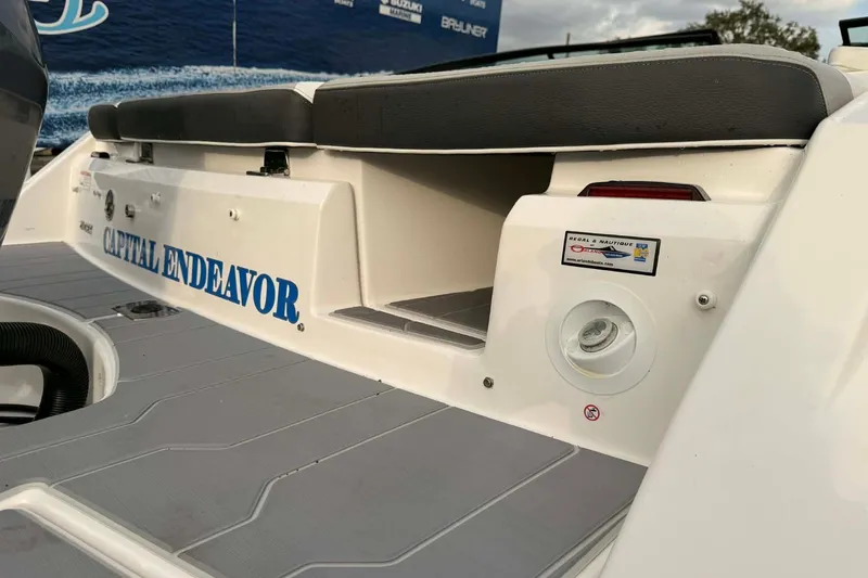 Slide: The Image of 2023 Regal 21 OBX boat rear view with "Capital Endeavor" text and seating area. - 13