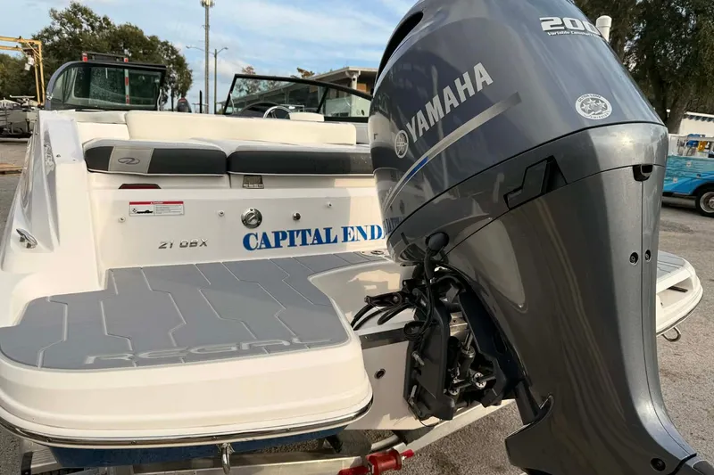 Slide: The Image of 2023 Regal 21 OBX boat with Yamaha 200 engine, rear view. - 15