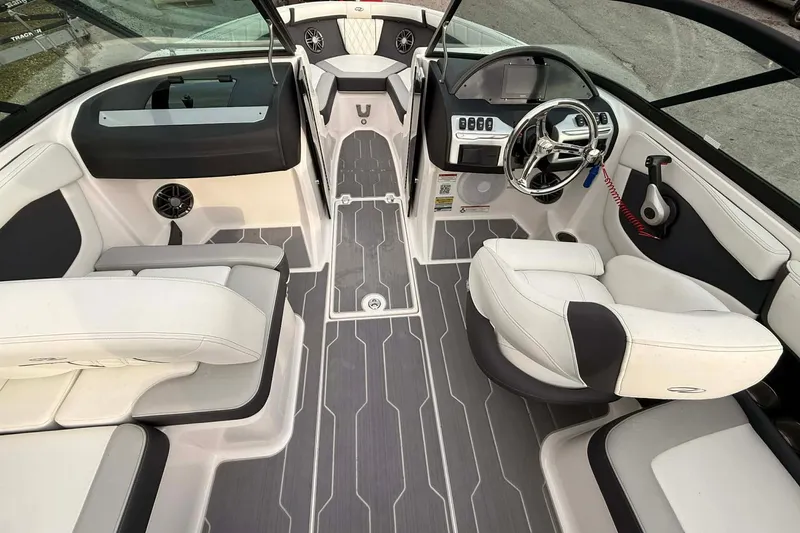 Slide: The Image of 2023 Regal 21 OBX boat interior with modern dashboard and seating. - 4