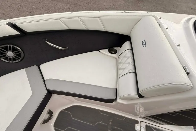 Slide: The Image of 2023 Regal 21 OBX boat interior with white seating and speaker. - 8