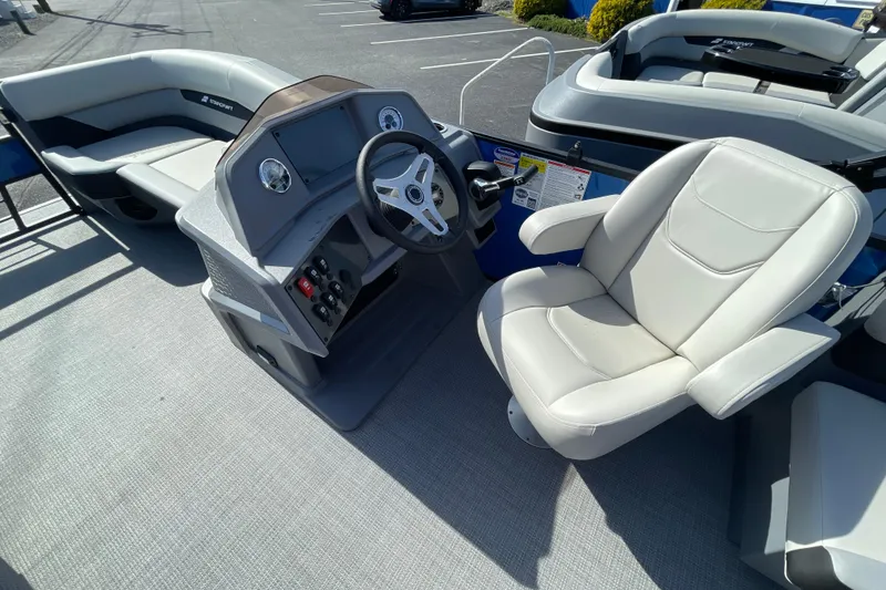 Slide: The Image of 2026 Starcraft VX 20 R DH boat interior with steering console and seating. - 10