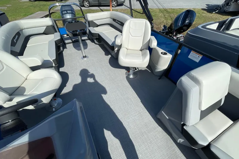 Slide: The Image of Luxurious interior of 2026 Starcraft VX 20 R DH pontoon boat with plush seating. - 6