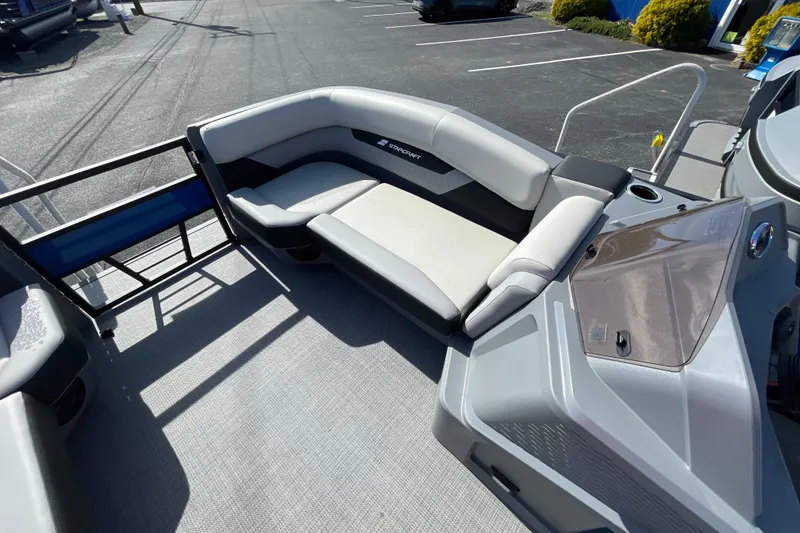Slide: The Image of 2026 Starcraft VX 20 R DH boat interior with modern seating and console design. - 8