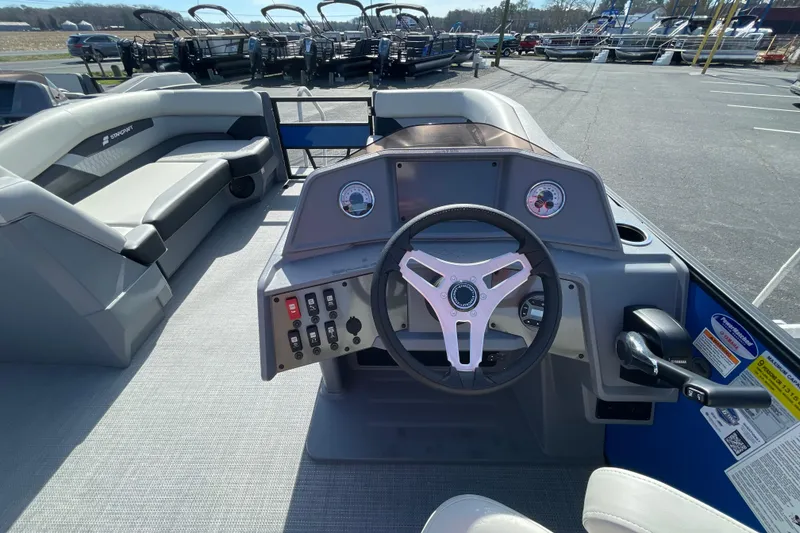 Slide: The Image of Interior view of 2026 Starcraft VX 20 R DH boat, featuring steering console and seating. - 9