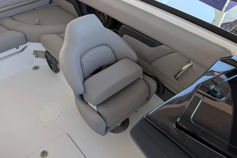 Slide: The Image of 2026 Four Winns HD5 OB boat interior with gray seating and modern design. - 15