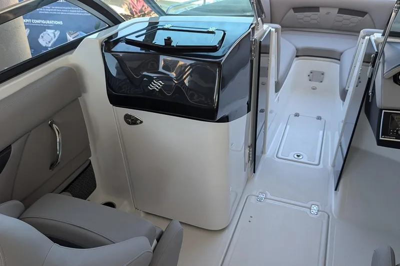 Slide: The Image of Interior of 2026 Four Winns HD5 OB boat, featuring sleek seating and modern design. - 16