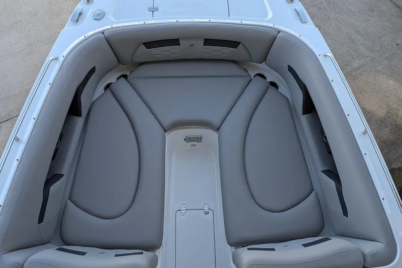 Slide: The Image of 2026 Four Winns HD5 OB boat interior with gray cushioned seating. - 18