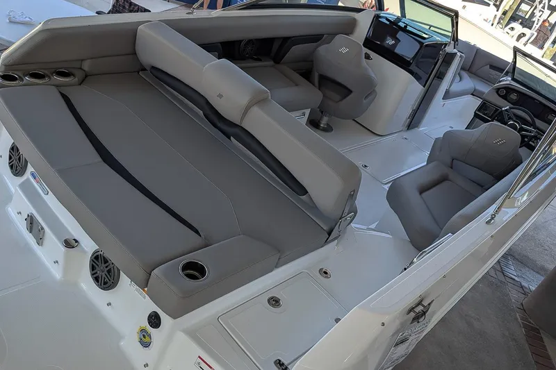 Slide: The Image of 2026 Four Winns HD5 OB boat interior with gray seating and modern dashboard. - 4