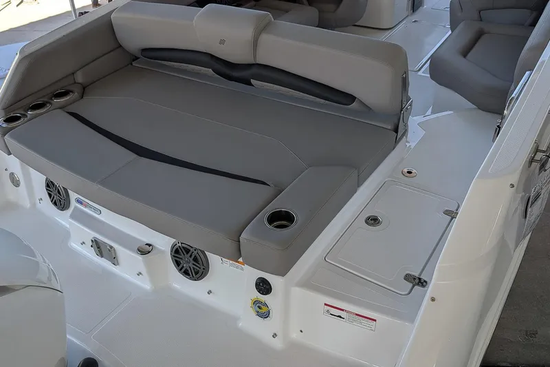 Slide: The Image of 2026 Four Winns HD5 OB boat interior with gray seating and cup holders. - 5