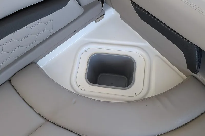 Slide: The Image of 2026 Four Winns HD5 OB boat interior with built-in storage compartment. - 8