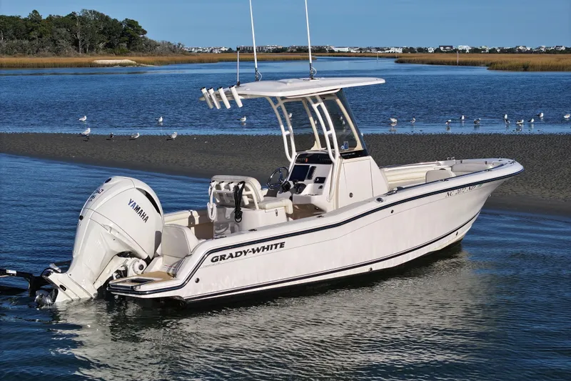 The Image of 2024 Grady-White Fisherman 216 boat on calm water with Yamaha engine. - 0