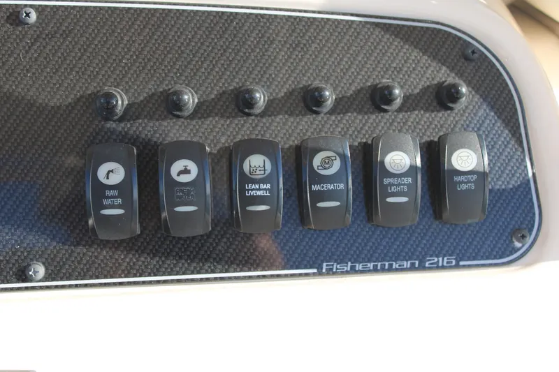 Slide: The Image of Control panel of 2024 Grady-White Fisherman 216 boat with labeled switches. - 15
