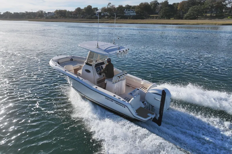 Slide: The Image of Aerial view of 2024 Grady-White Fisherman 216 boat cruising on open water. - 4