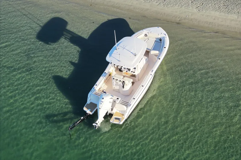 Slide: The Image of 2024 Grady-White Fisherman 216 boat on calm water with Yamaha engine. - 5