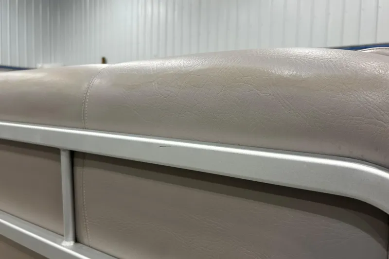 Slide: The Image of Close-up of beige seating on a 2009 Premier 240 SunSpree boat. - 11