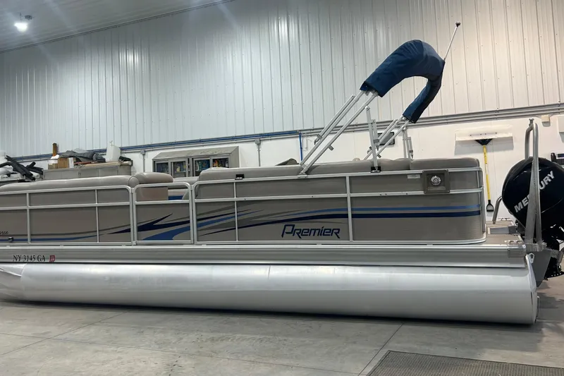Slide: The Image of 2009 Premier 240 SunSpree pontoon boat in indoor storage, side view. - 12