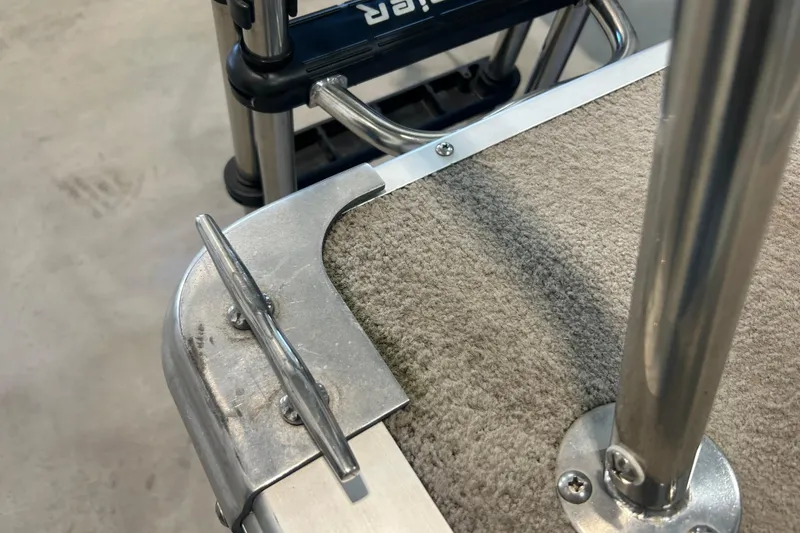 Slide: The Image of Close-up of a 2009 Premier 240 SunSpree boat's metal cleat and carpeted deck. - 17