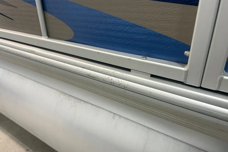 Slide: The Image of Close-up of 2009 Premier 240 SunSpree pontoon boat with blue and gray detailing. - 18