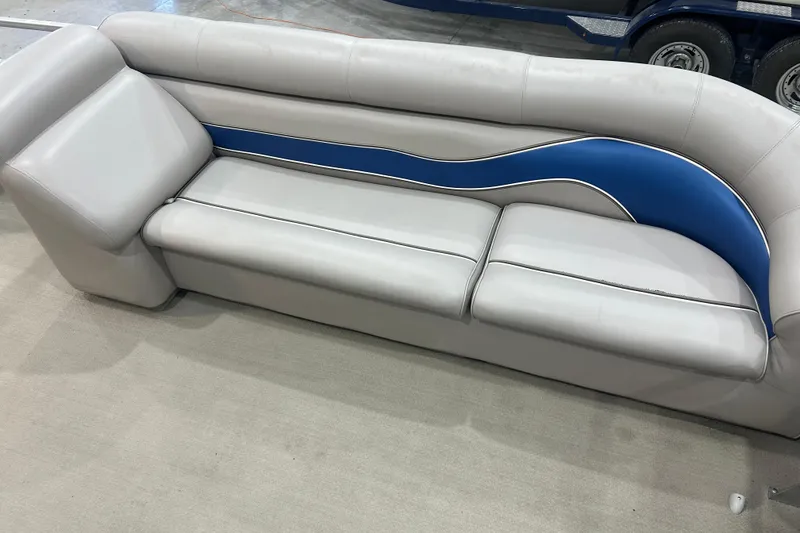 Slide: The Image of 2009 Premier 240 SunSpree boat seat with gray and blue upholstery design. - 26