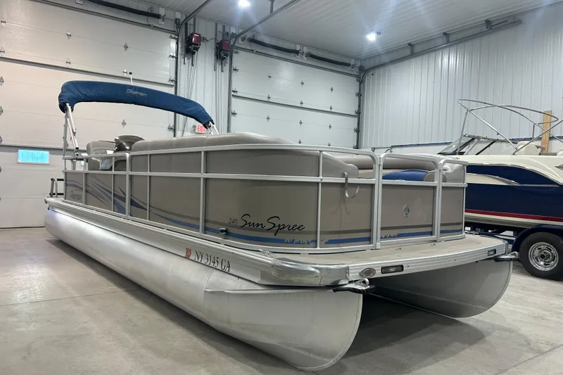 Slide: The Image of 2009 Premier 240 SunSpree pontoon boat in indoor storage facility. - 3