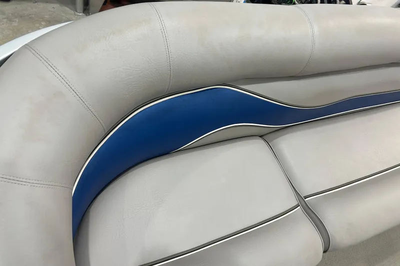 Slide: The Image of 2009 Premier 240 SunSpree boat seat with blue and gray upholstery detail. - 30