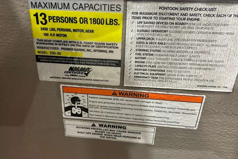 Slide: The Image of Warning labels and safety checklist on a 2009 Premier 240 SunSpree boat. - 37