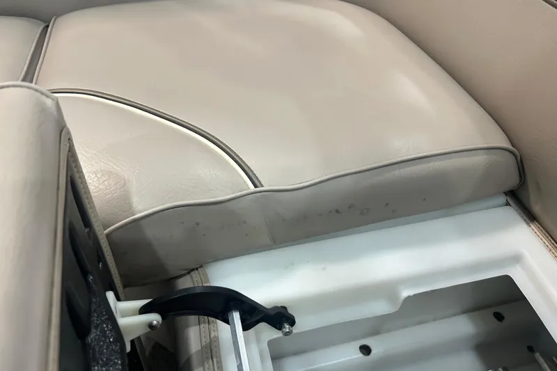 Slide: The Image of 2009 Premier 240 SunSpree boat seat with storage compartment, beige upholstery. - 40