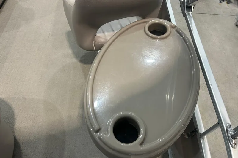 Slide: The Image of 2009 Premier 240 SunSpree boat interior with beige cup holder and seat. - 42