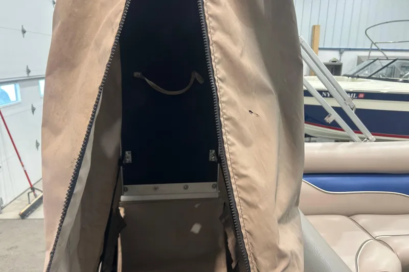 Slide: The Image of 2009 Premier 240 SunSpree boat interior with tan cover and seating. - 44