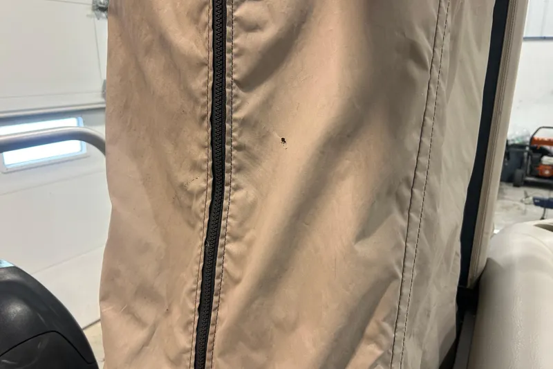 Slide: The Image of Close-up of a 2009 Premier 240 SunSpree boat cover with a visible zipper. - 46