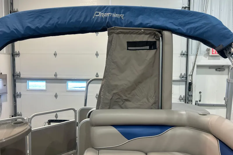Slide: The Image of 2009 Premier 240 SunSpree pontoon boat interior with blue canopy and beige seating. - 47