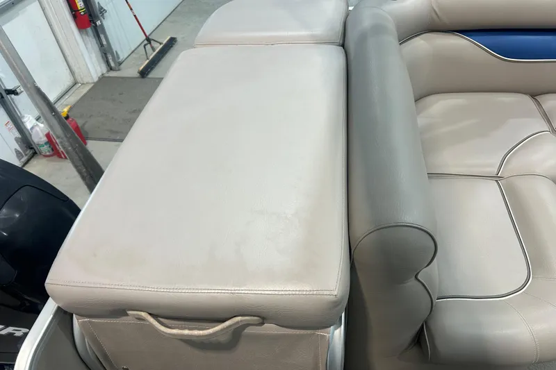 Slide: The Image of 2009 Premier 240 SunSpree boat interior with gray leather seating and storage compartment. - 48