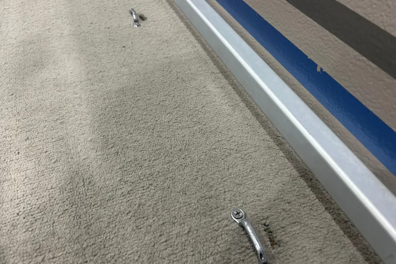 Slide: The Image of Carpeted floor with metal tools on a 2009 Premier 240 SunSpree boat. - 5