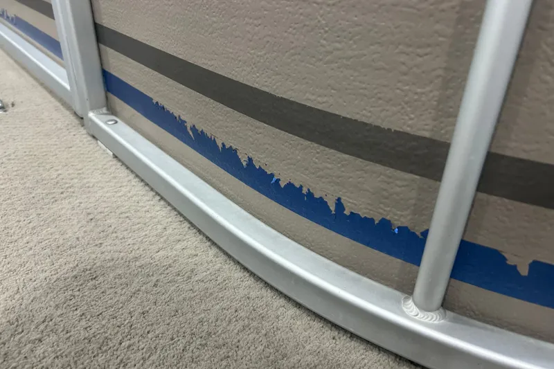 Slide: The Image of Close-up of 2009 Premier 240 SunSpree boat with peeling blue paint and metal frame. - 6