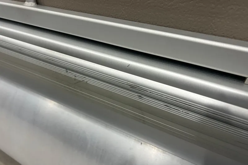 Slide: The Image of Close-up of 2009 Premier 240 SunSpree aluminum detailing, showcasing sleek design and craftsmanship. - 7