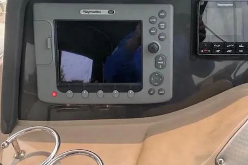 Slide: The Image of Raymarine navigation system on 2007 Four Winns 378 Vista boat dashboard. - 15