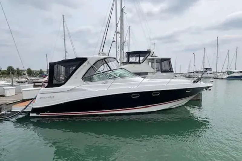 Slide: The Image of 2007 Four Winns 378 Vista yacht docked in a marina, surrounded by other boats. - 4