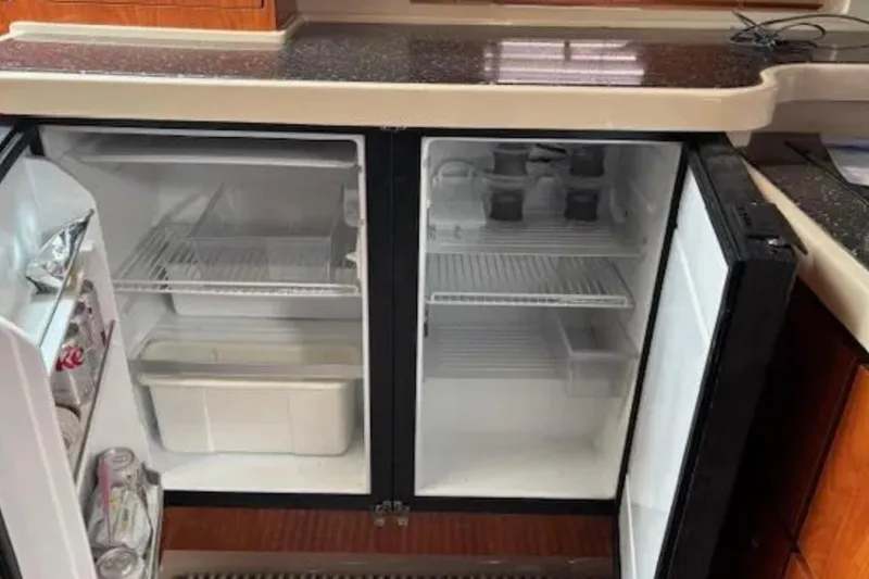 Slide: The Image of Refrigerator inside 2007 Four Winns 378 Vista yacht, open with drinks and storage. - 6