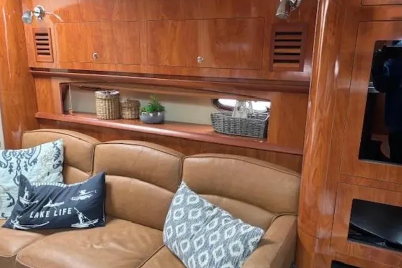 Slide: The Image of Luxurious 2007 Four Winns 378 Vista yacht interior with leather seating and wooden cabinetry. - 7