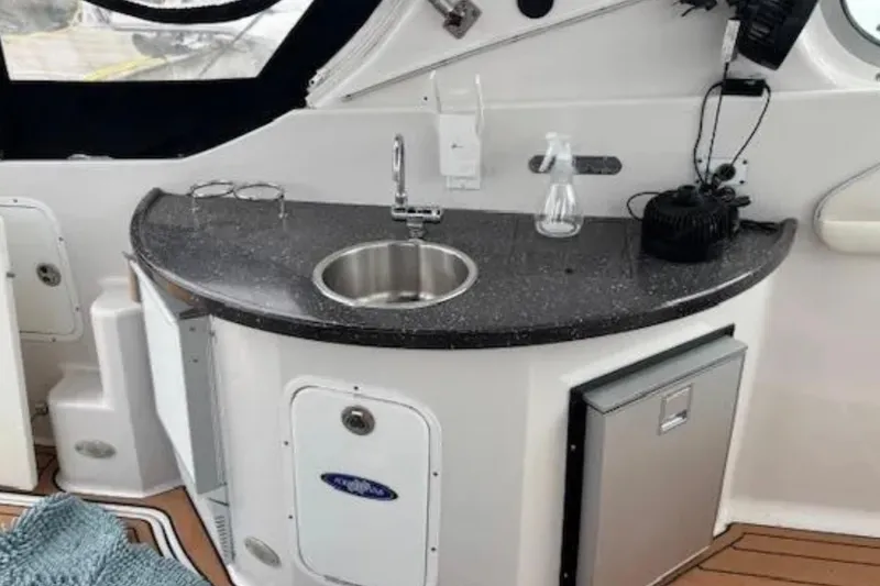 Slide: The Image of 2007 Four Winns 378 Vista boat interior with kitchenette, sink, and countertop. - 9