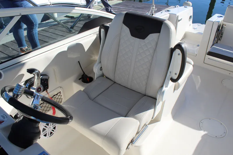 Slide: The Image of 2024 Sailfish 226DC boat cockpit with luxurious seating. - 15