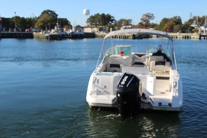 Slide: The Image of 2024 Sailfish 226DC boat on calm water in harbor. - 6