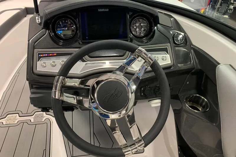 Slide: The Image of 2024 Monterey 238SS Super Sport dashboard with sleek steering wheel and modern controls. - 10