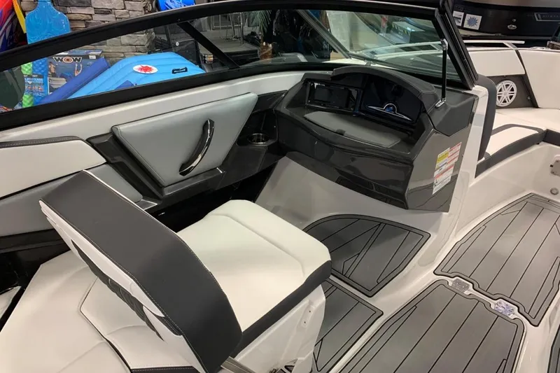 Slide: The Image of 2024 Monterey 238SS Super Sport boat interior with sleek seating and modern dashboard. - 11