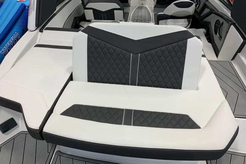 Slide: The Image of 2024 Monterey 238SS Super Sport boat interior with stylish black and white seating. - 5