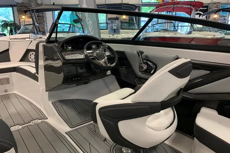 Slide: The Image of 2024 Monterey 238SS Super Sport boat interior with sleek steering and modern seating. - 9
