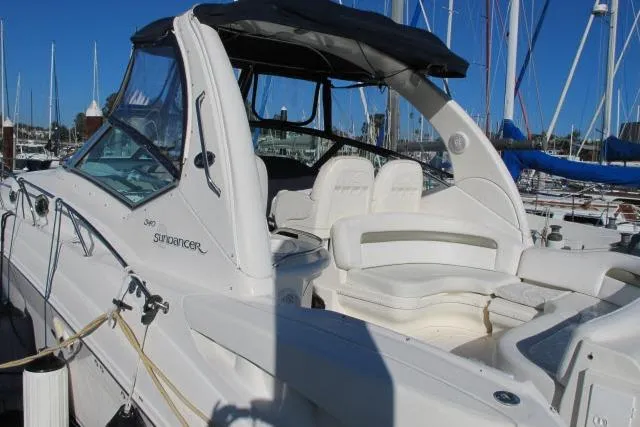 Slide: The Image of 2007 Sea Ray 340 Sundancer yacht docked at marina, featuring sleek design and comfortable seating. - 21