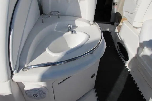 Slide: The Image of 2007 Sea Ray 340 Sundancer boat interior with sink and cup holders. - 22