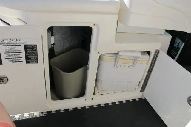 Slide: The Image of 2007 Sea Ray 340 Sundancer storage area with trash bin and cooler. - 24